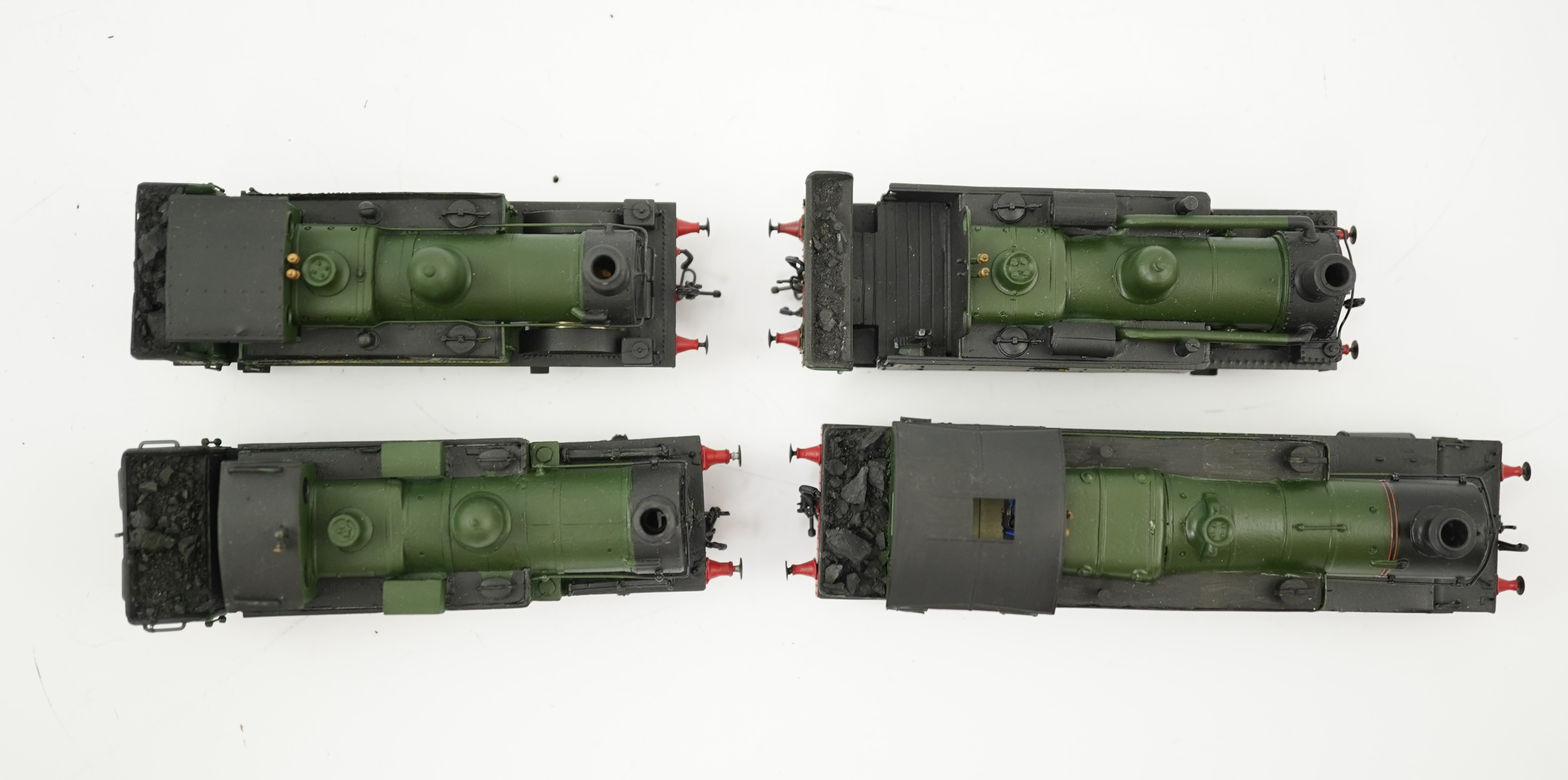 Four 00 gauge kit built GWR tank locomotives, three brass and white metal; a 14xx class 2-4-0T, 1458, together with an 517 class 0-4-2T, 574, and a 633 class 0-4-2T, 633, plus a plastic/resin and metal 46xx class 4-4-2T,